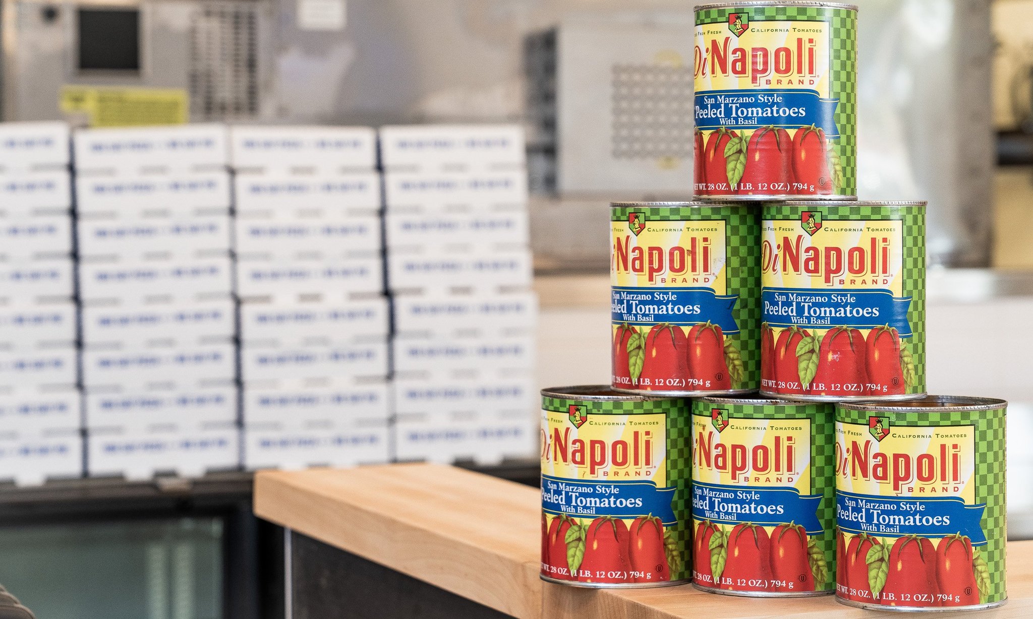 Square Pie Guys kitchen with stacked DiNapoli tomato cans