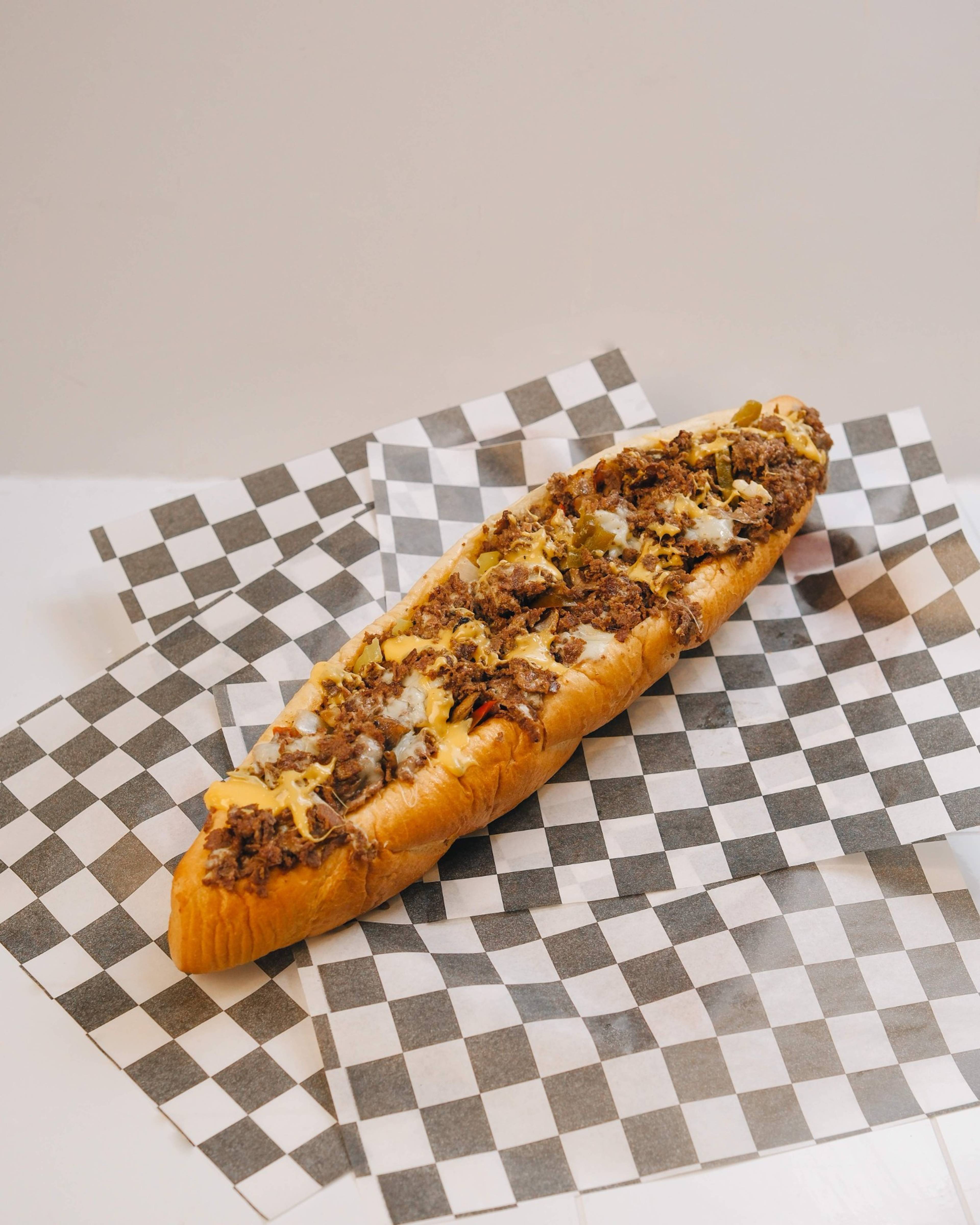 Big Dave's beef cheesesteak made the Dave's Way with melted cheese and grilled peppers