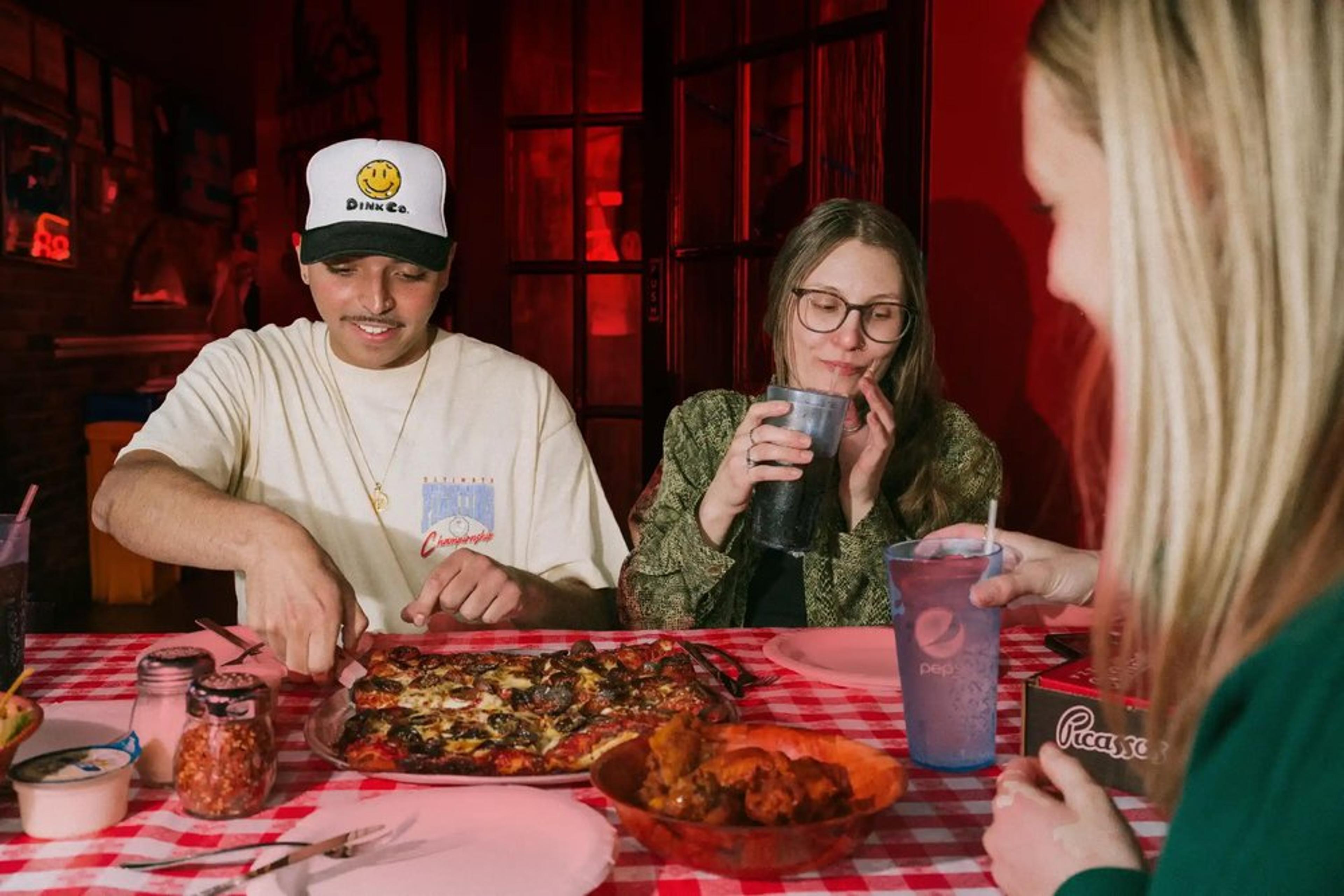 Friends enjoying a pizza party