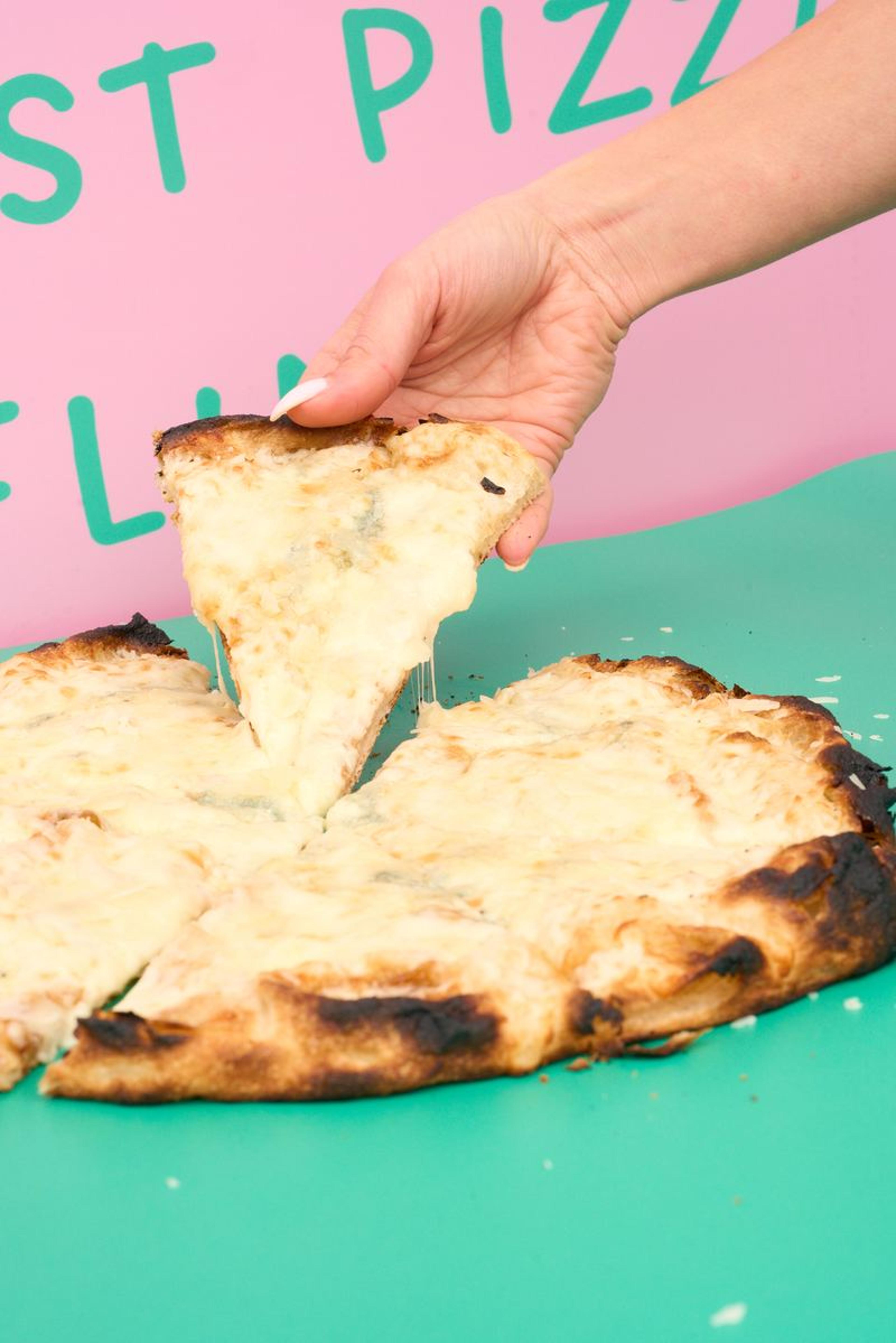 Fresh mozzarella cheese pull on an authentic Italian pizza