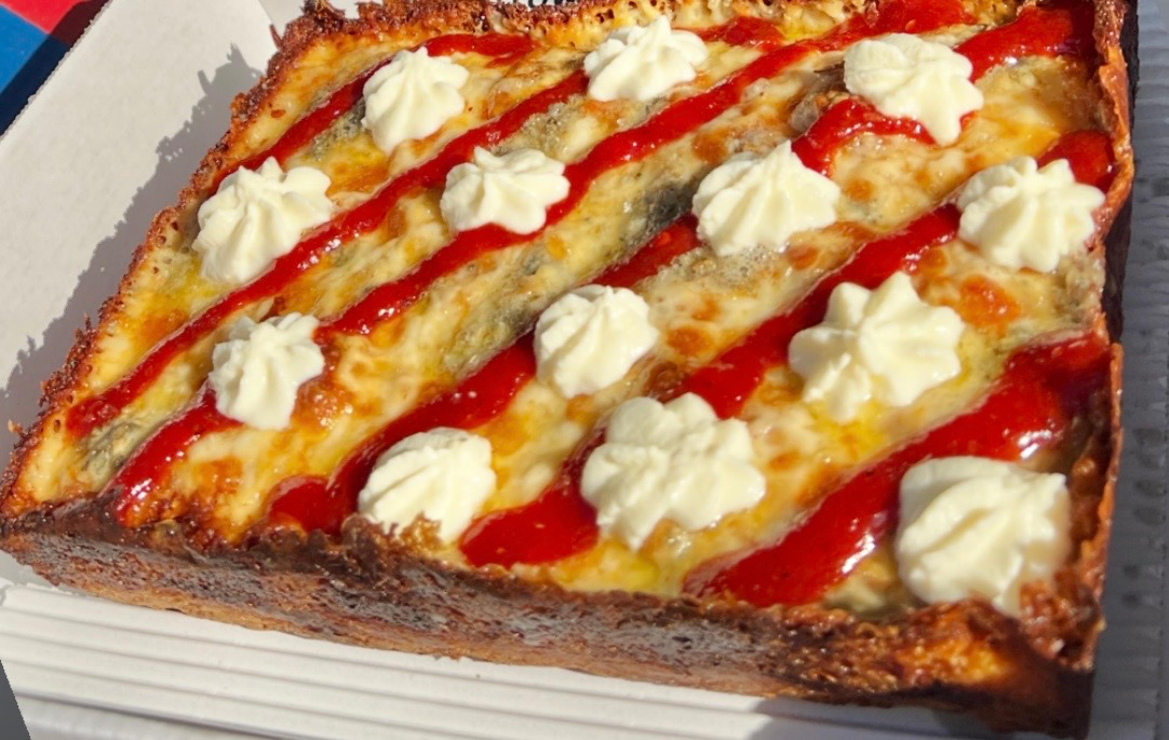 Dtown Pizzeria Detroit-style square with red sauce stripes and ricotta dollops