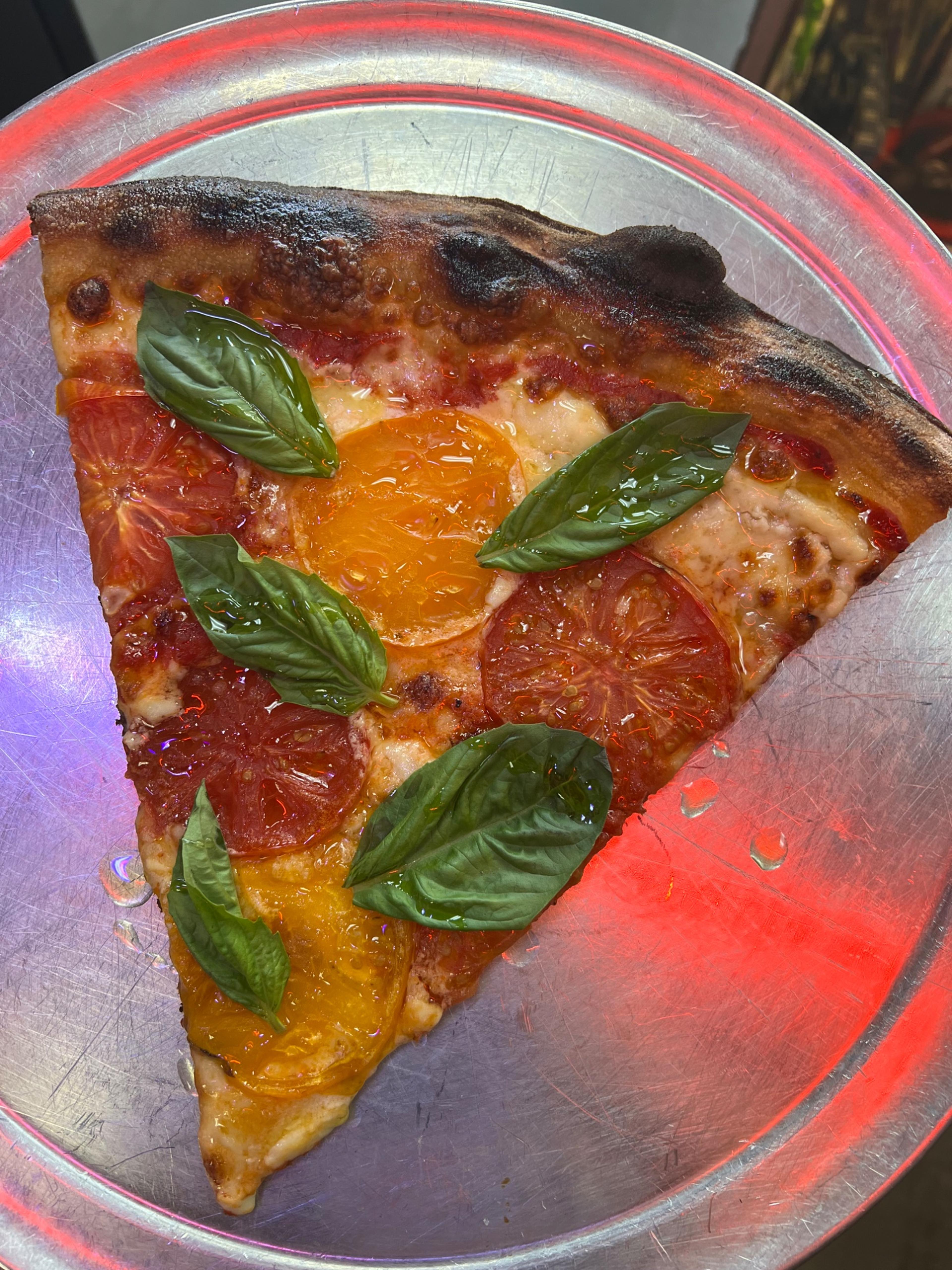 Dtown Pizzeria heirloom tomato slice with basil