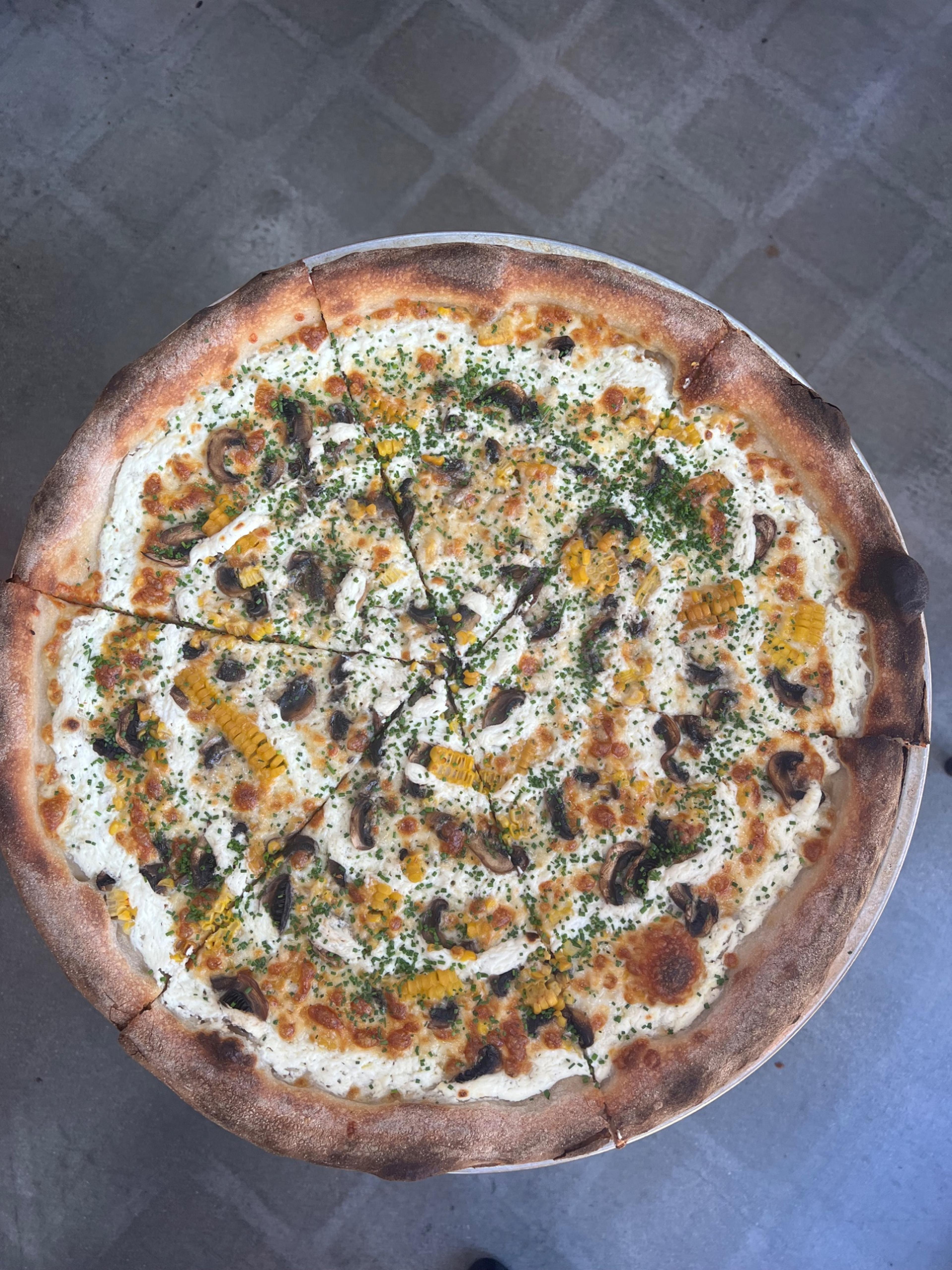 Dtown Pizzeria white pizza with mushroom and corn