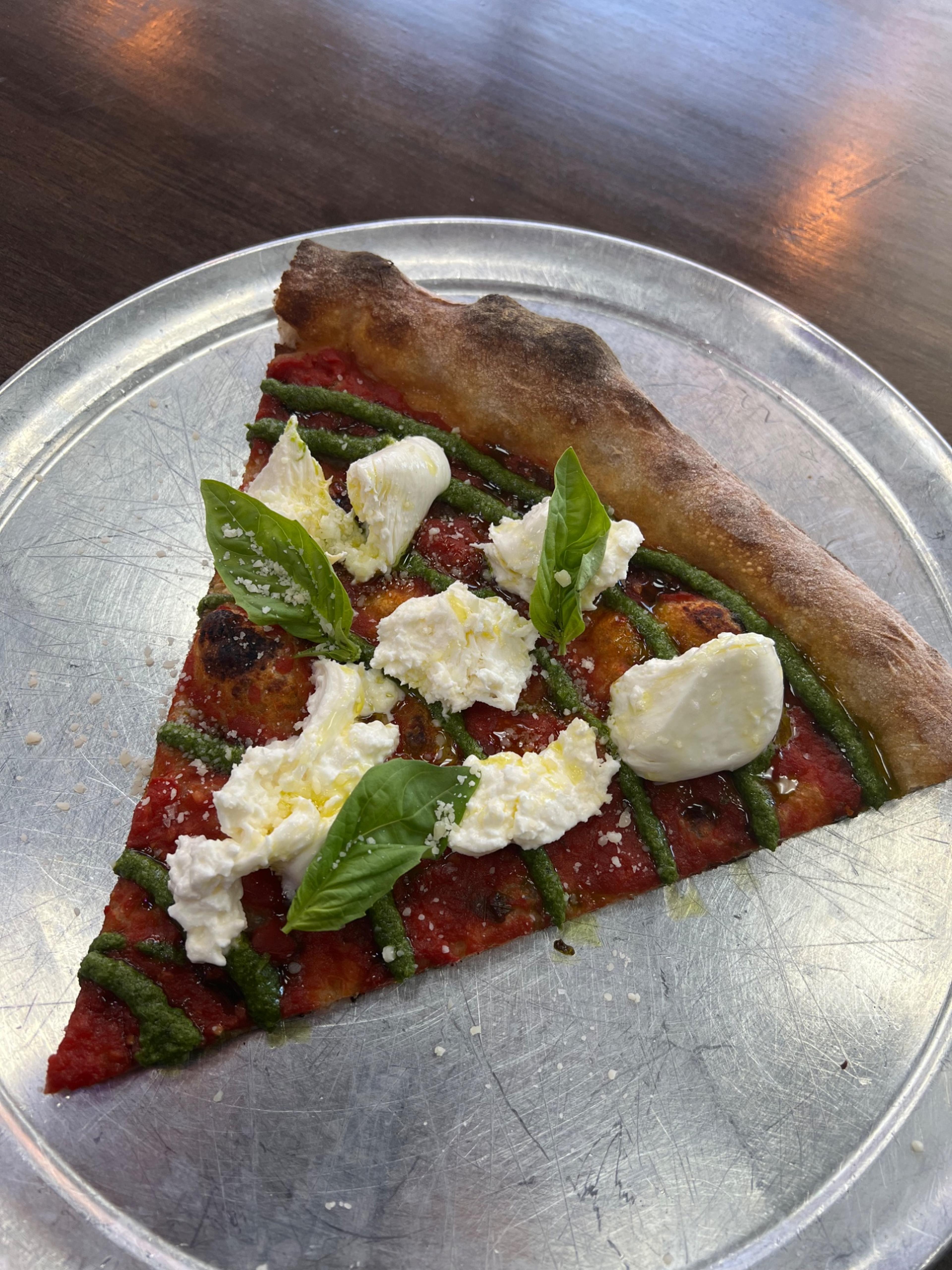 Dtown Pizzeria margherita slice with fresh mozzarella and basil