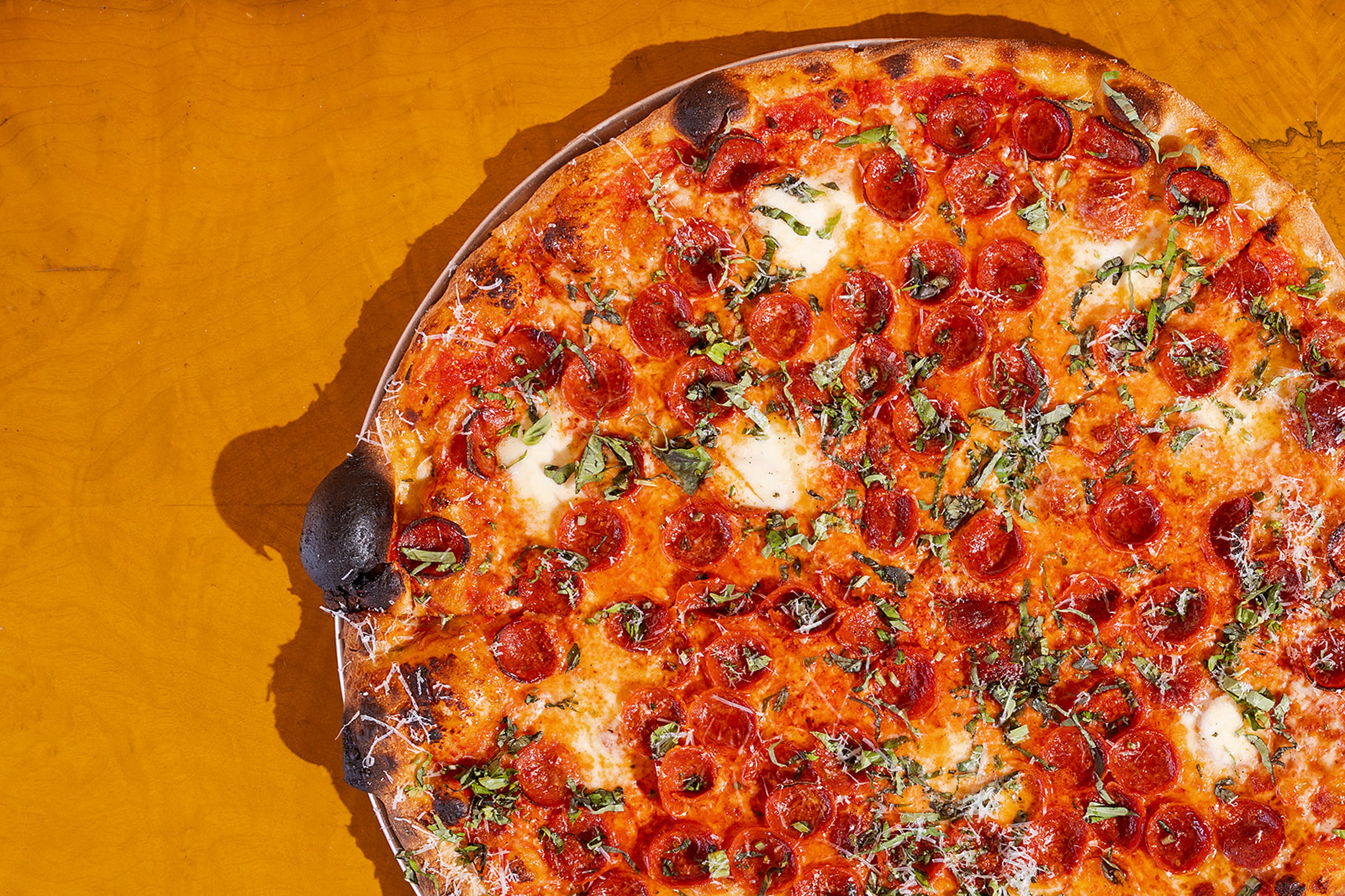 Hot Tongue Pizza slice being served