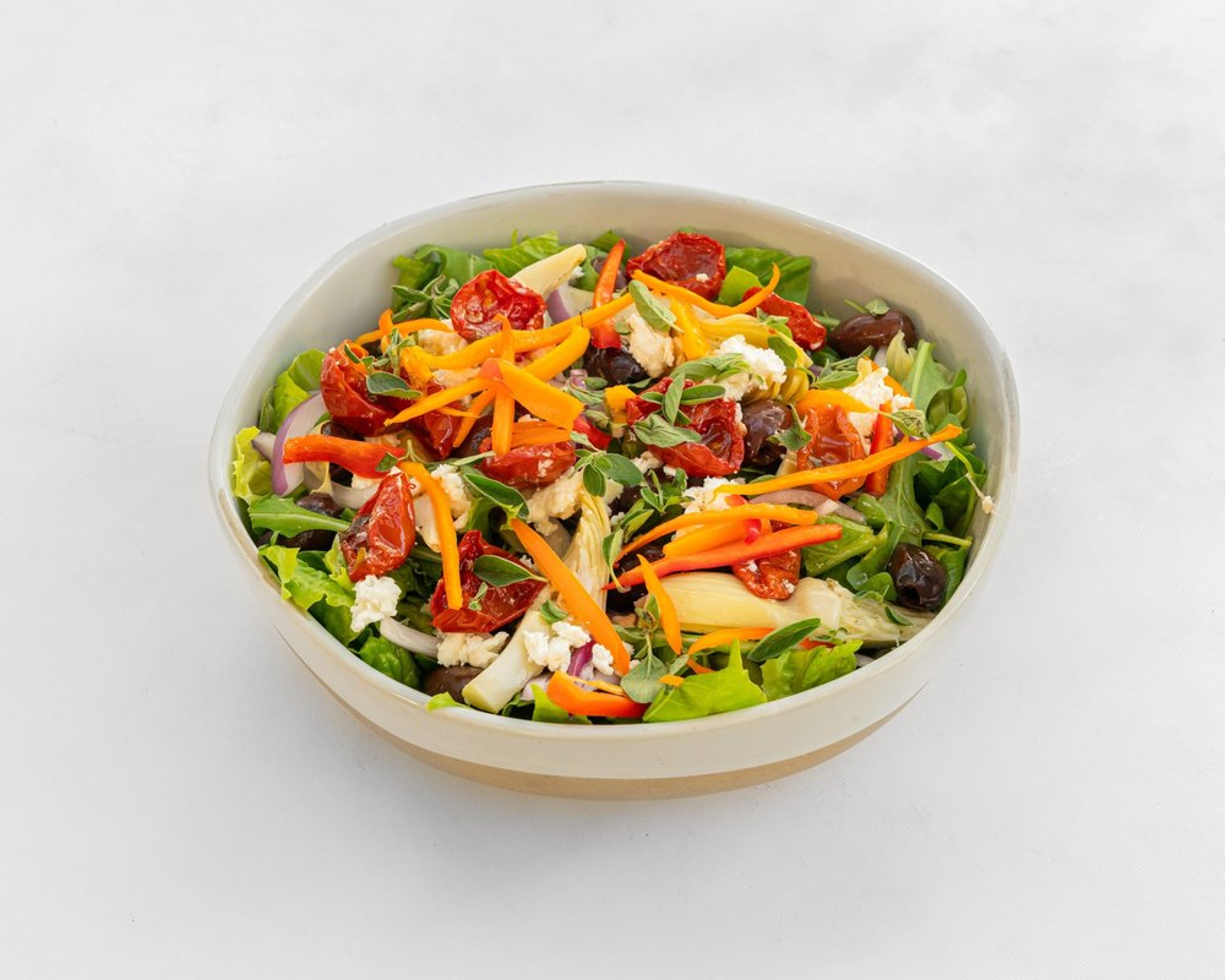Greek salad with romaine, artichoke, feta, kalamata olives and red pepper
