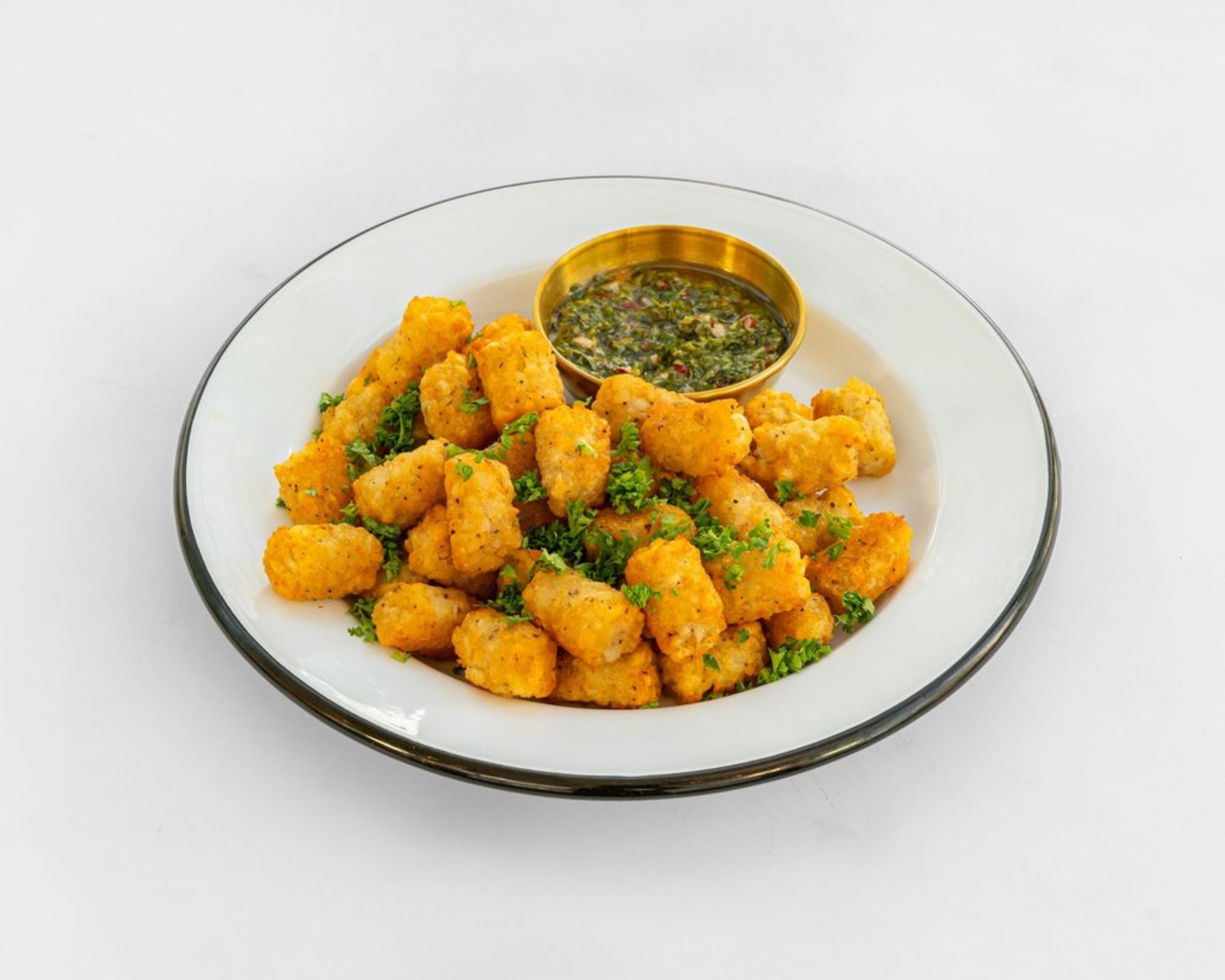 Tater tots topped with gremolata