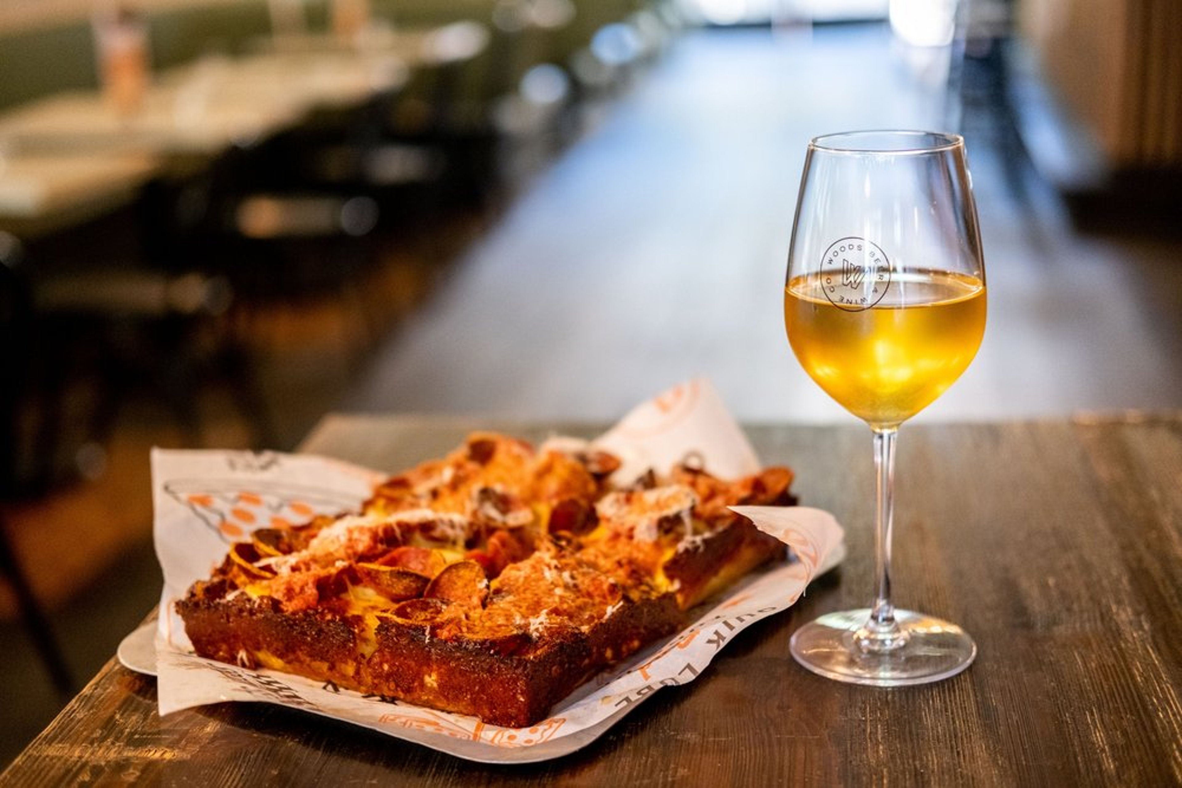 Joyride Detroit Style Pizza with Woods wine at Lowside location