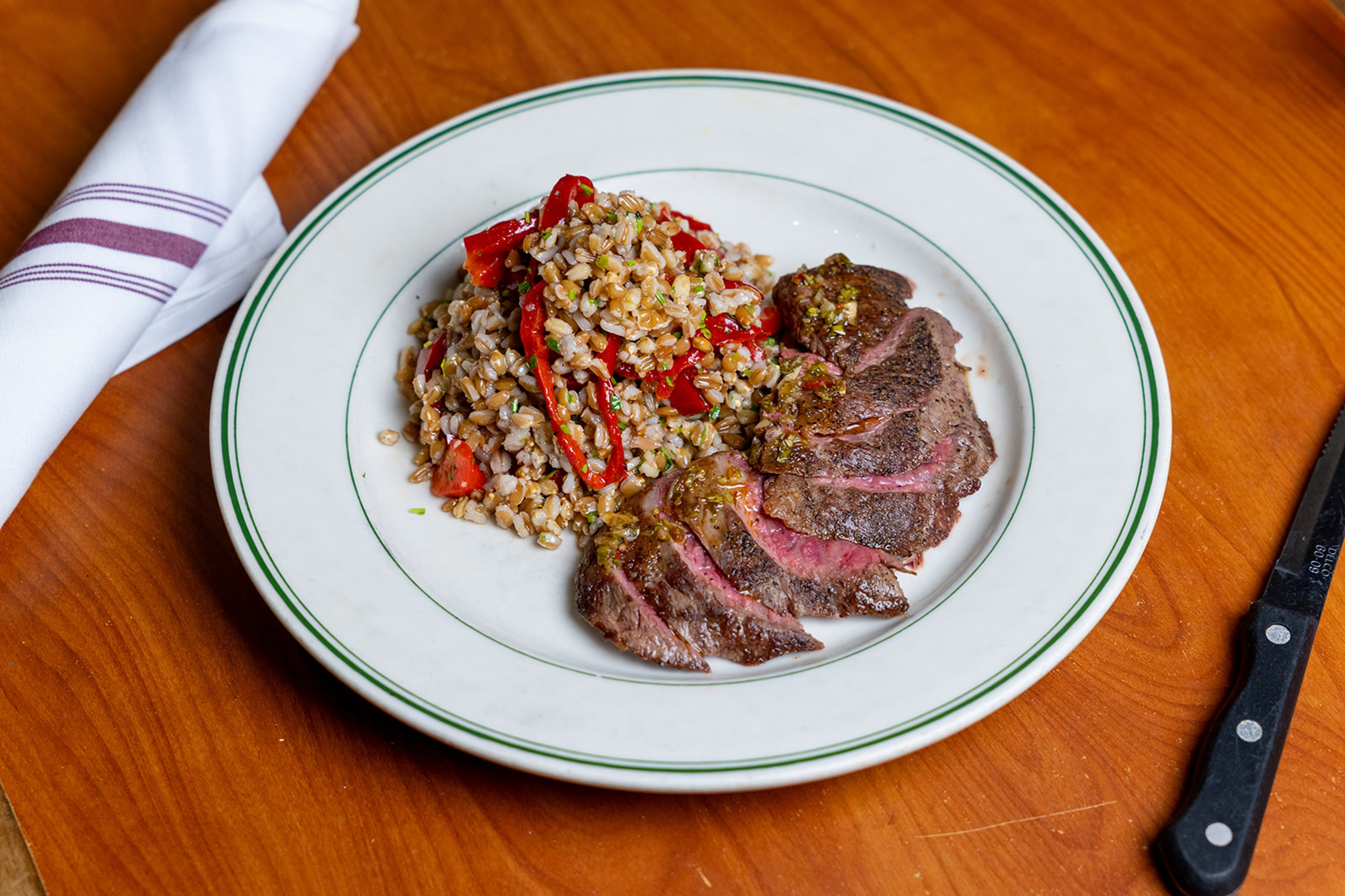 Sliced Flank Steak with farro and roasted red peppers