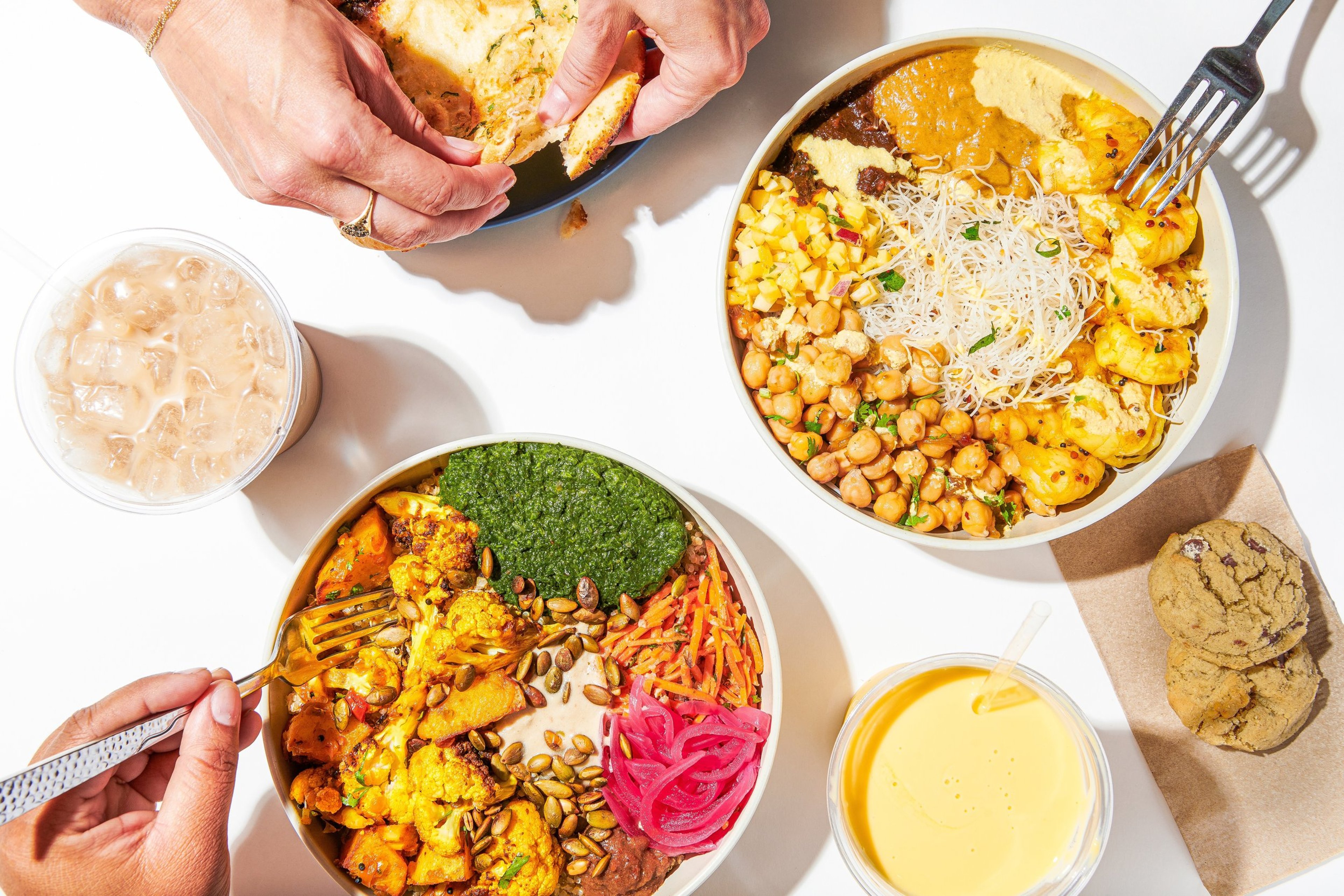 Indian food spread with bowls and naan