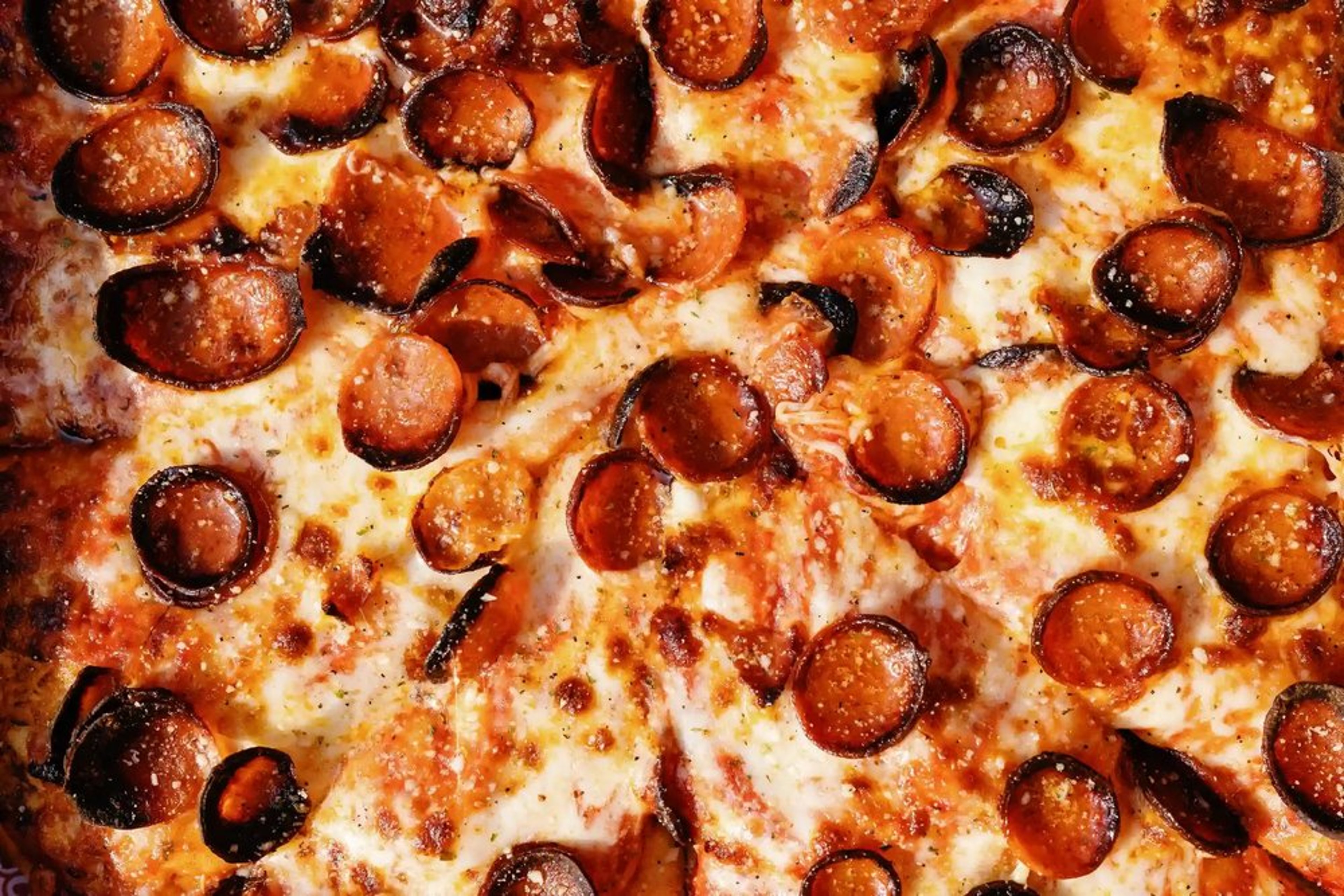 Close-up of Picasso's Pizza cup-and-char pepperoni pizza.
