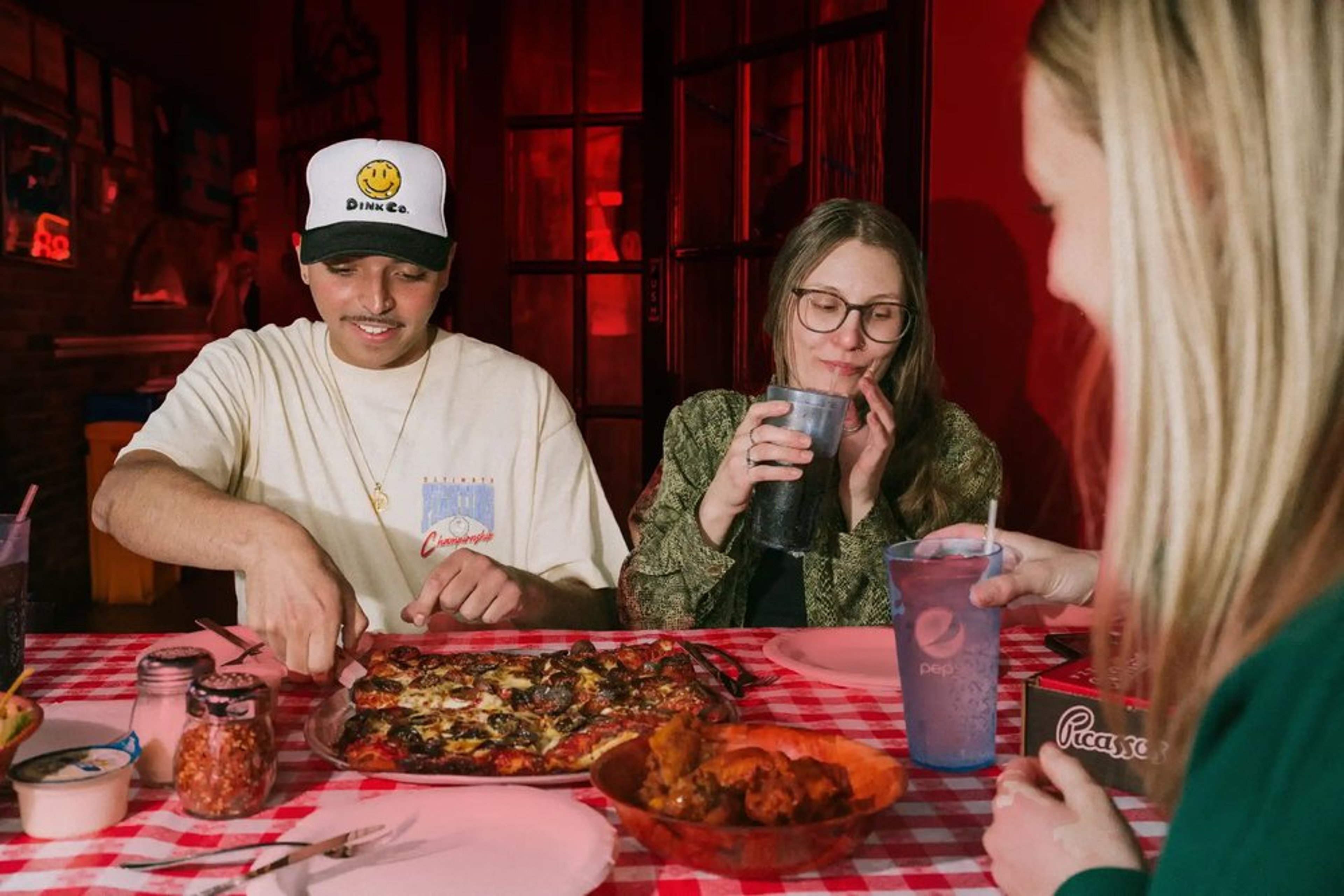 Friends enjoying a pizza party