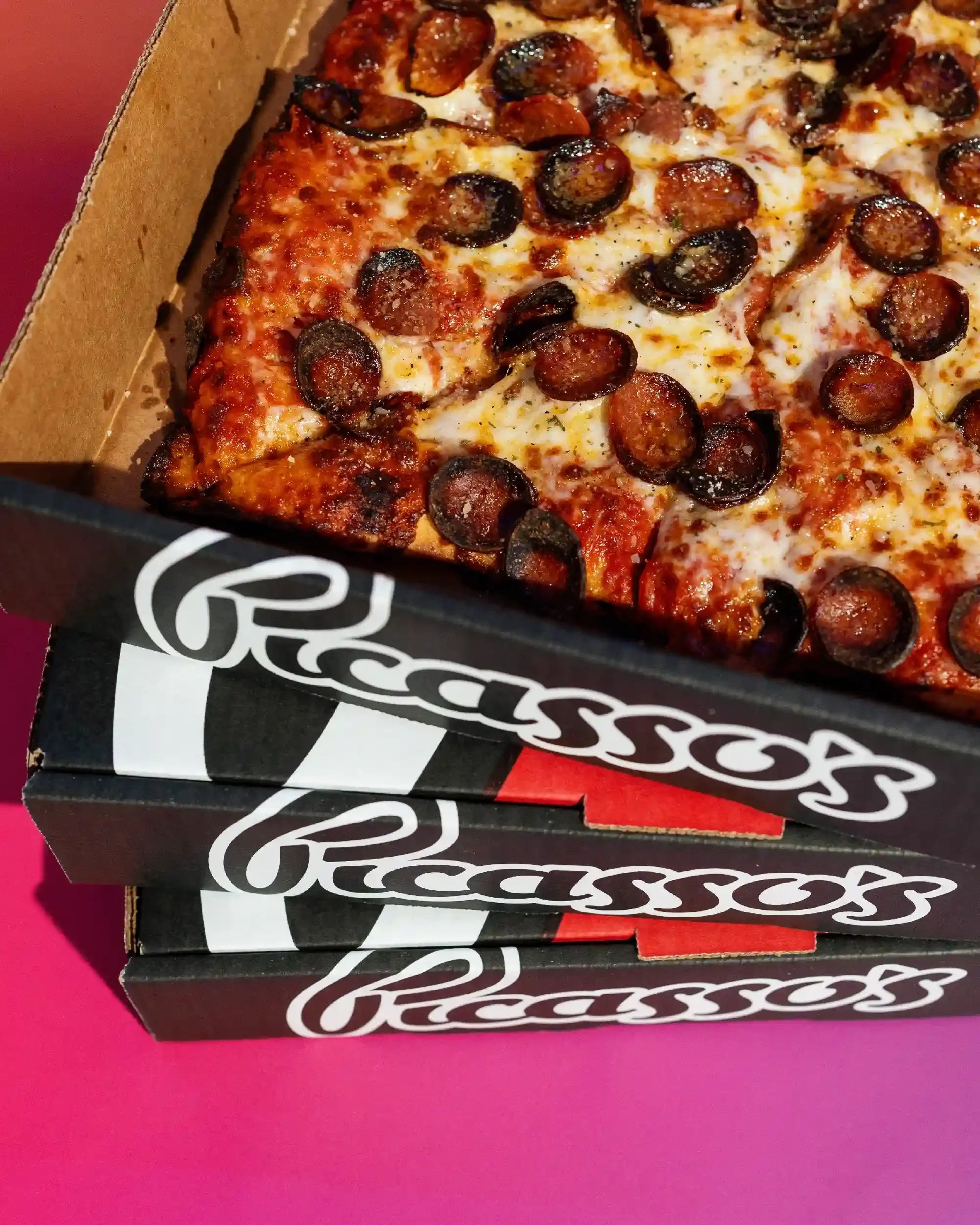 Stacked Picasso's Pizza boxes.