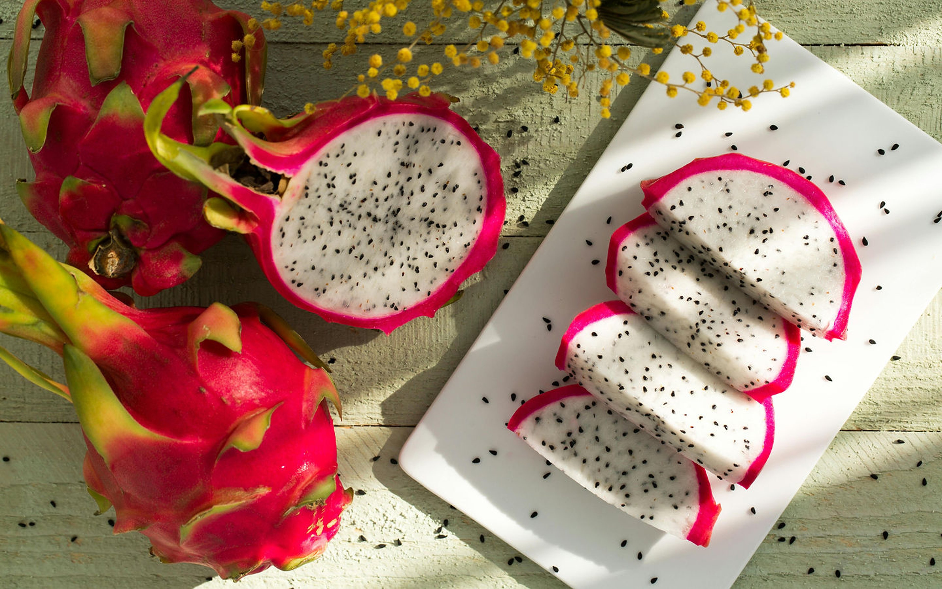 Sliced dragon fruit on a wooden board