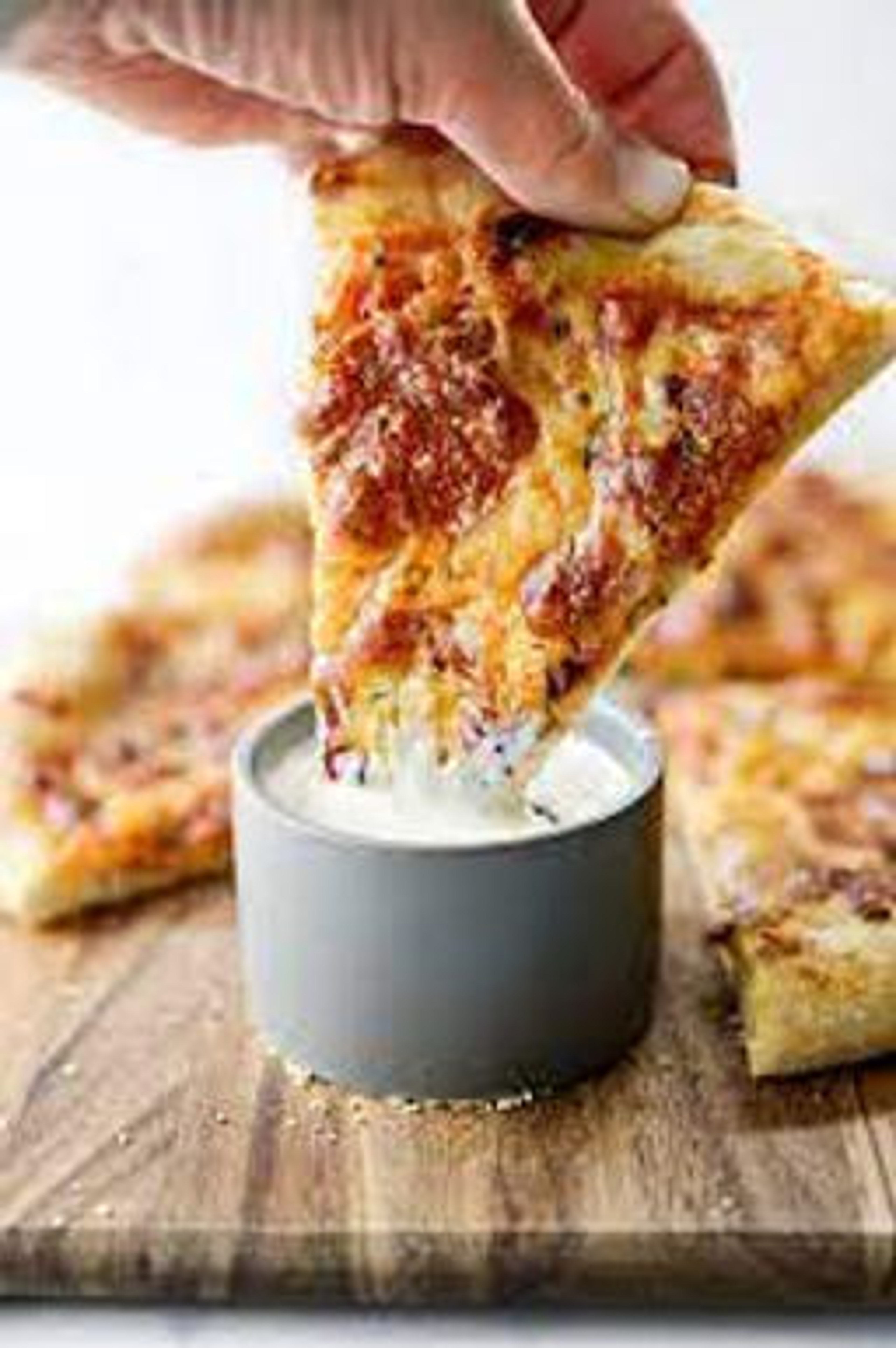 Ranch dressing and pizza at The Ria Pizzeria