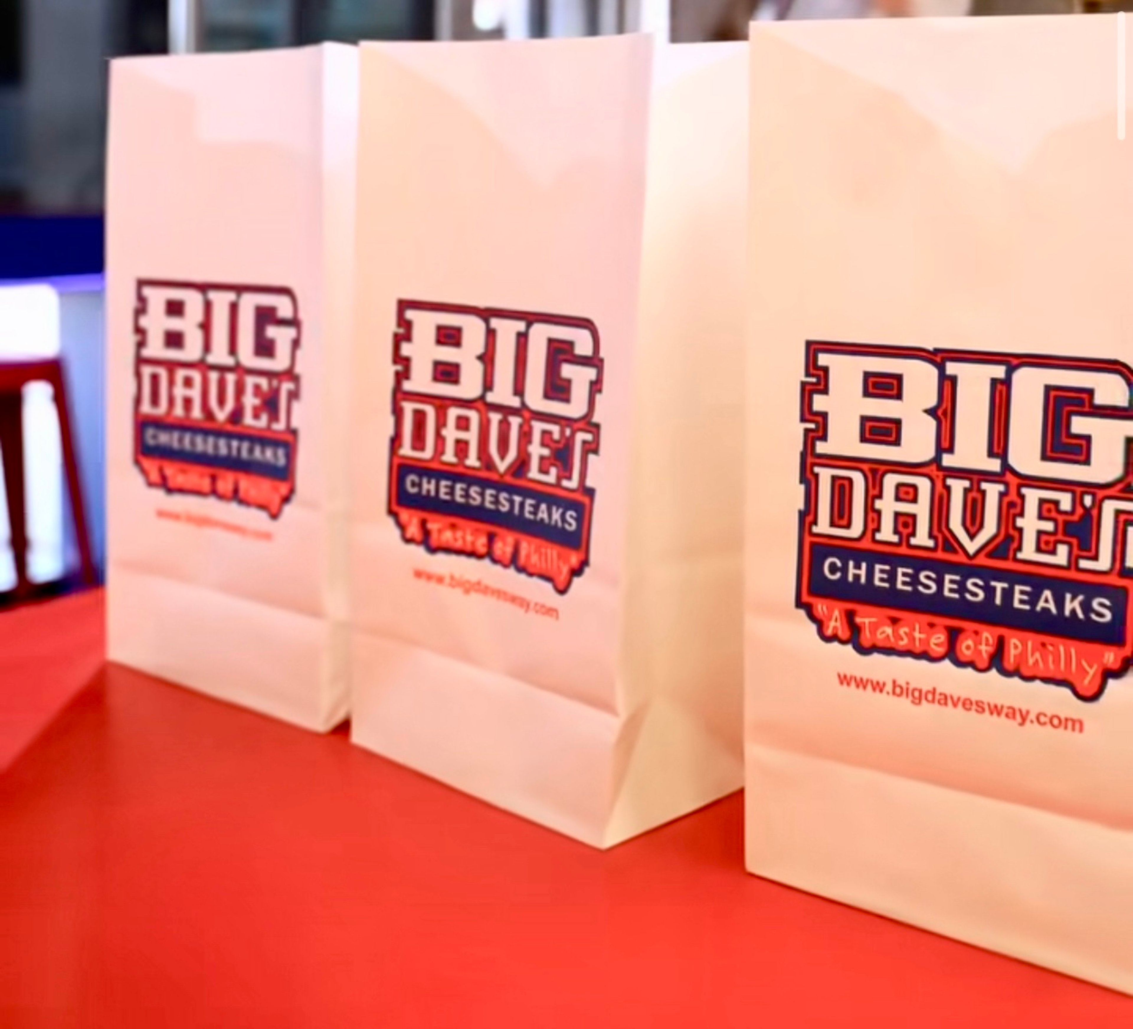 Big Dave's branded bagged lunches lined up and ready for catering pickup