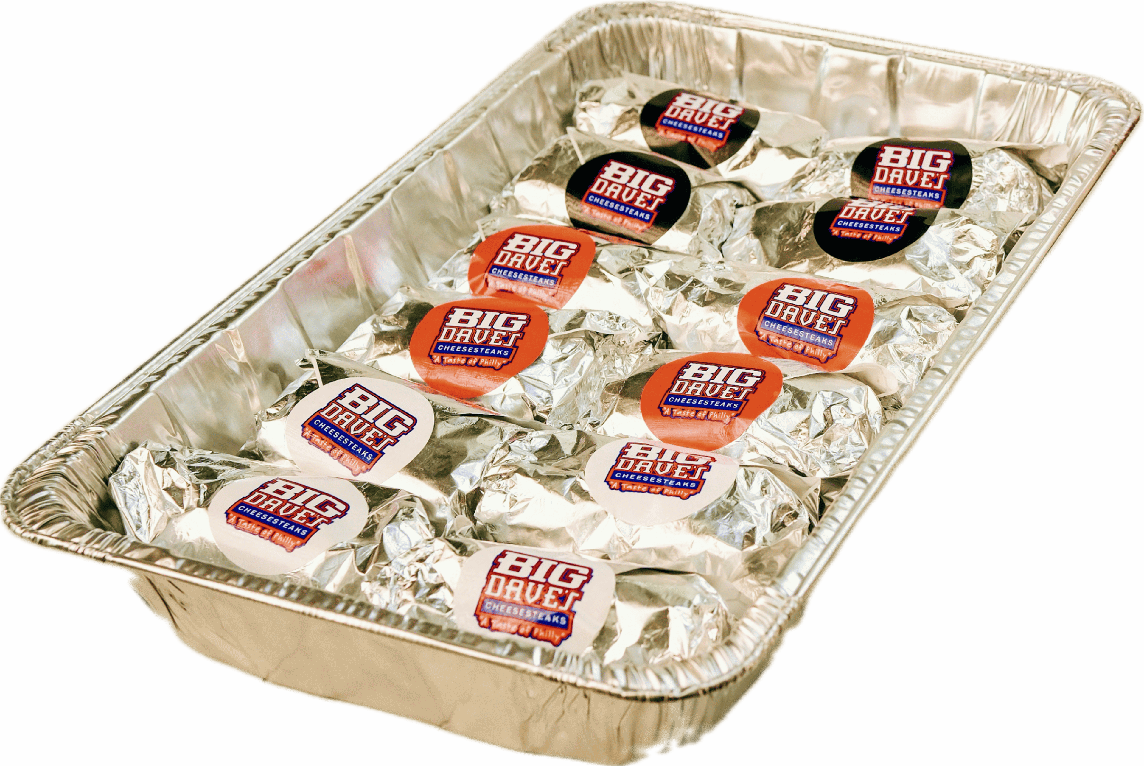 A Big Dave's catering tray filled with foil-wrapped cheesesteaks topped with Big Dave's Cheesesteaks stickers