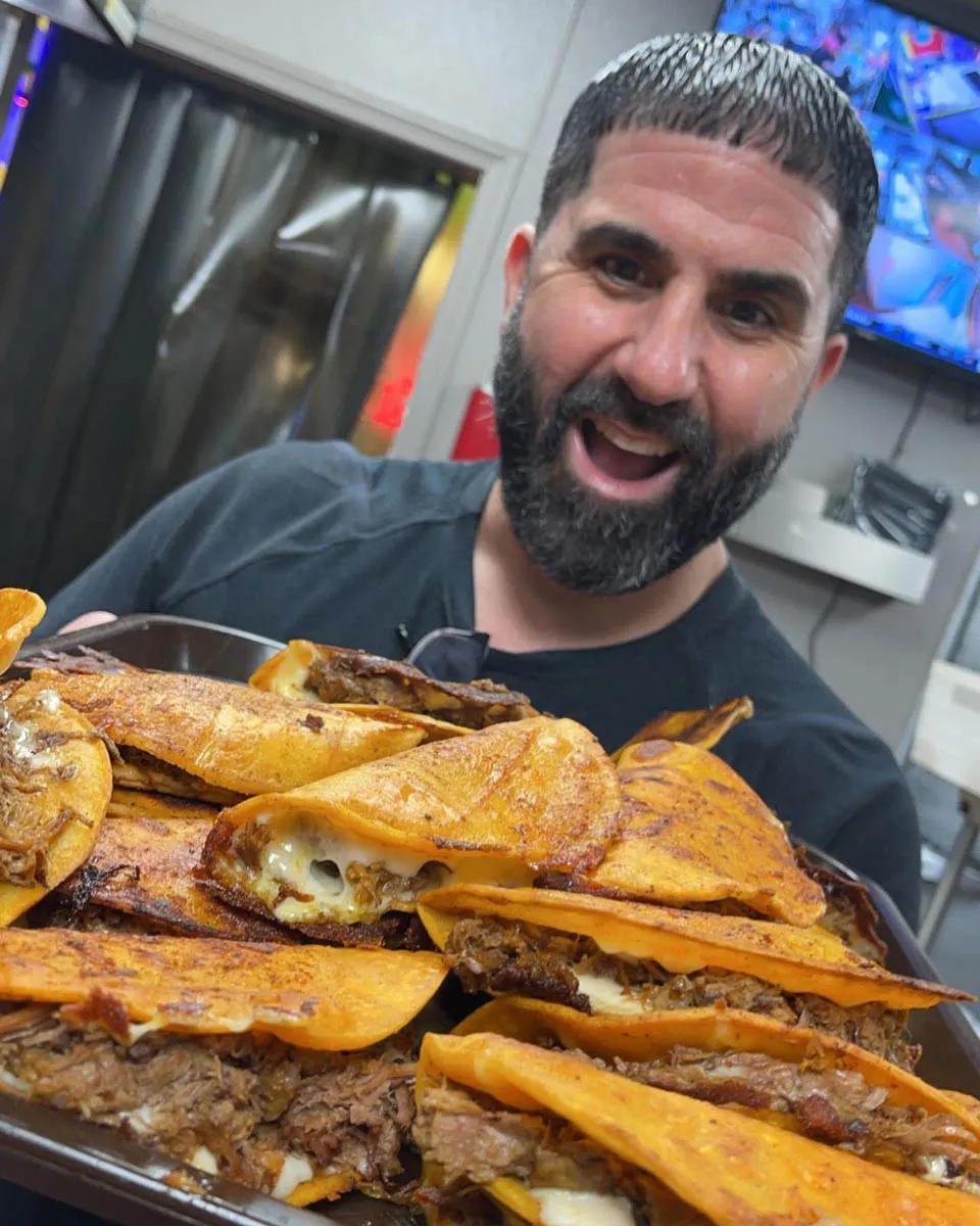 Ali Elreda eating Fatima's Grill food