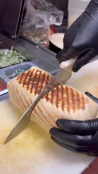 Inside a Fatima's Grill kitchen — food being prepared